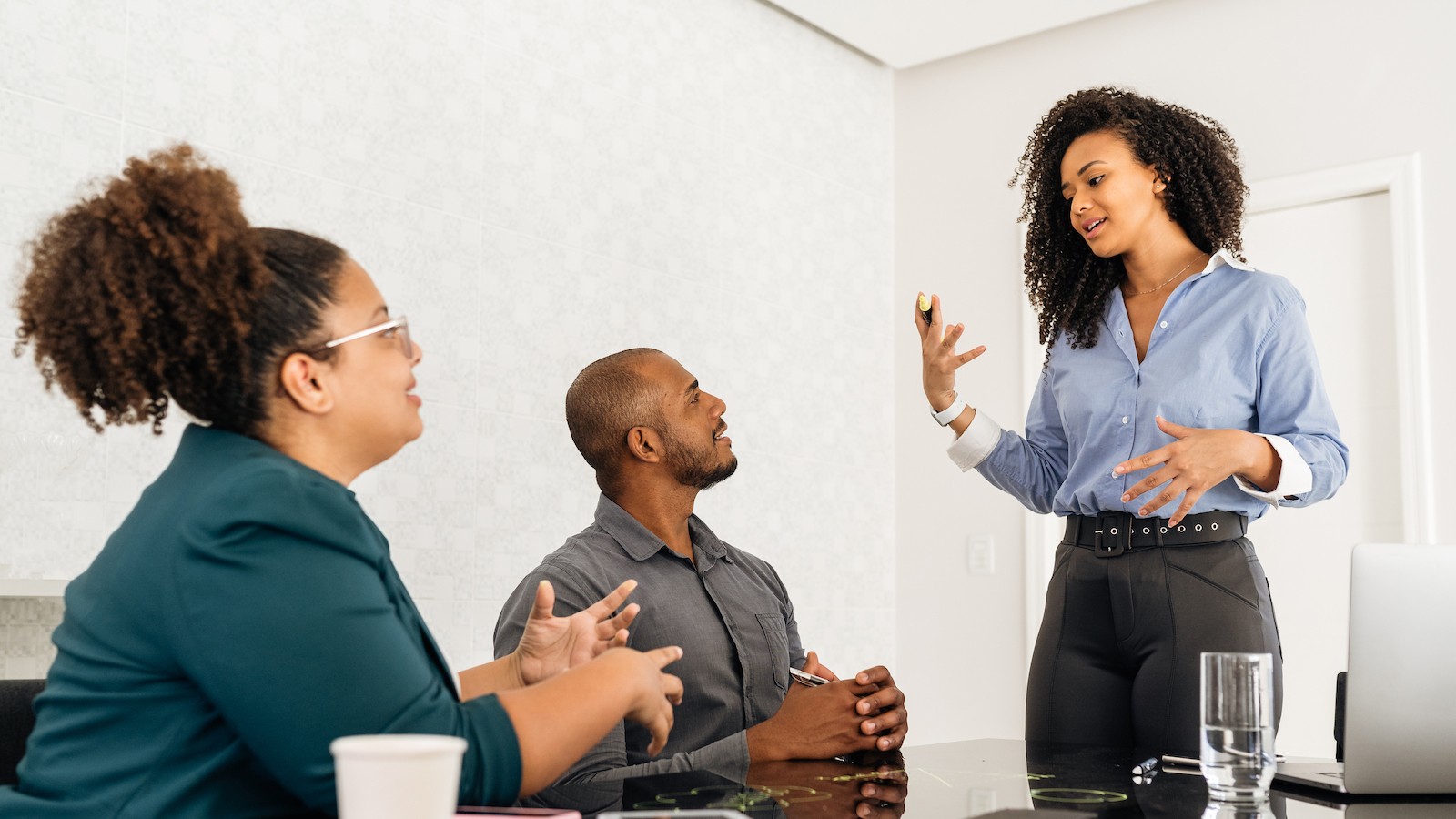 Woman presenting to colleagues